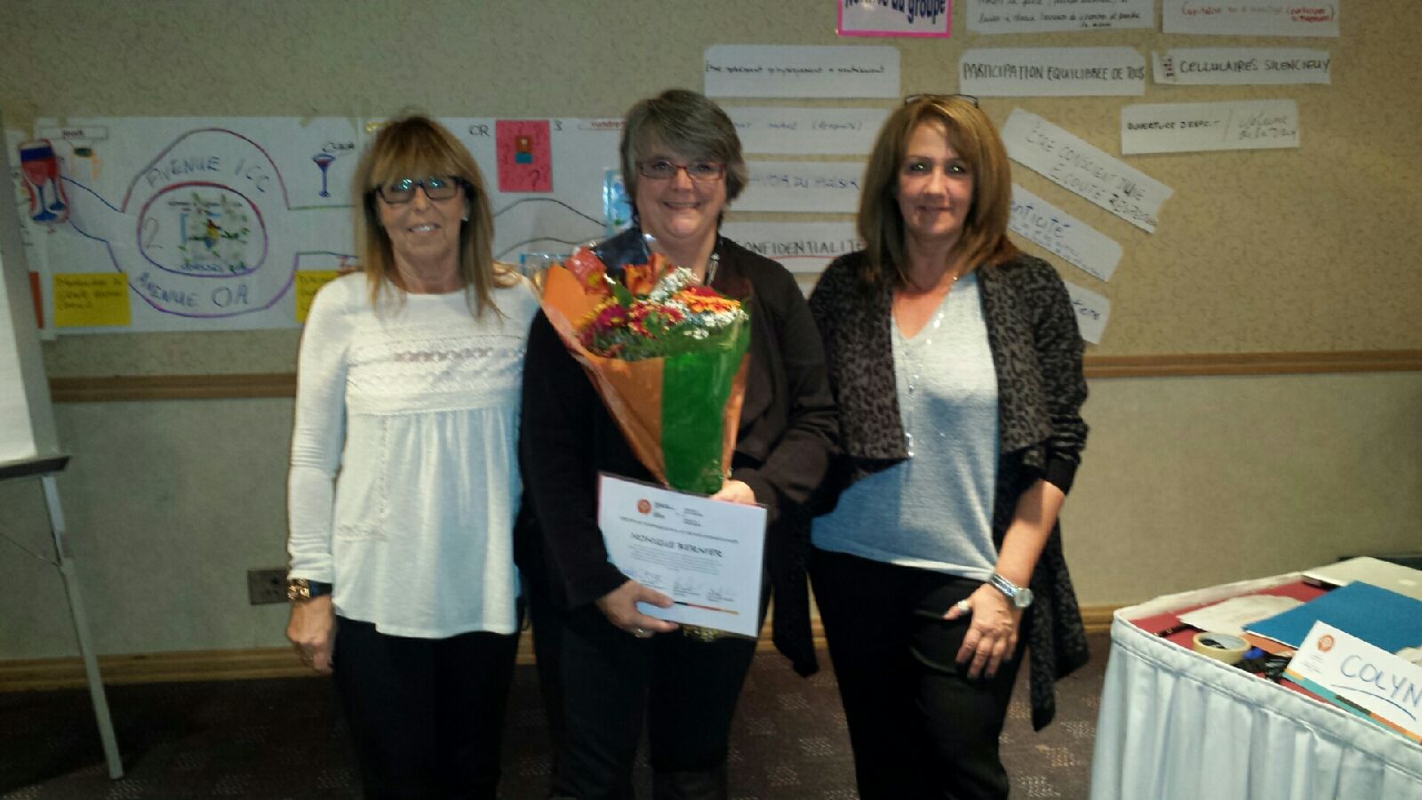 Carolle Lajoie (left) and Manon Bouchard (right) took the opportunity to recognize Monique Bernier&rsquo;s retirement from the Public Service